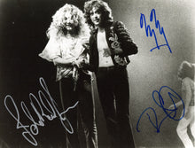 Load image into Gallery viewer, B&W Photo of Led Zeppelin with JSA Authenticated signatures of Robert Plant, Jimmy Page, John Paul Jones