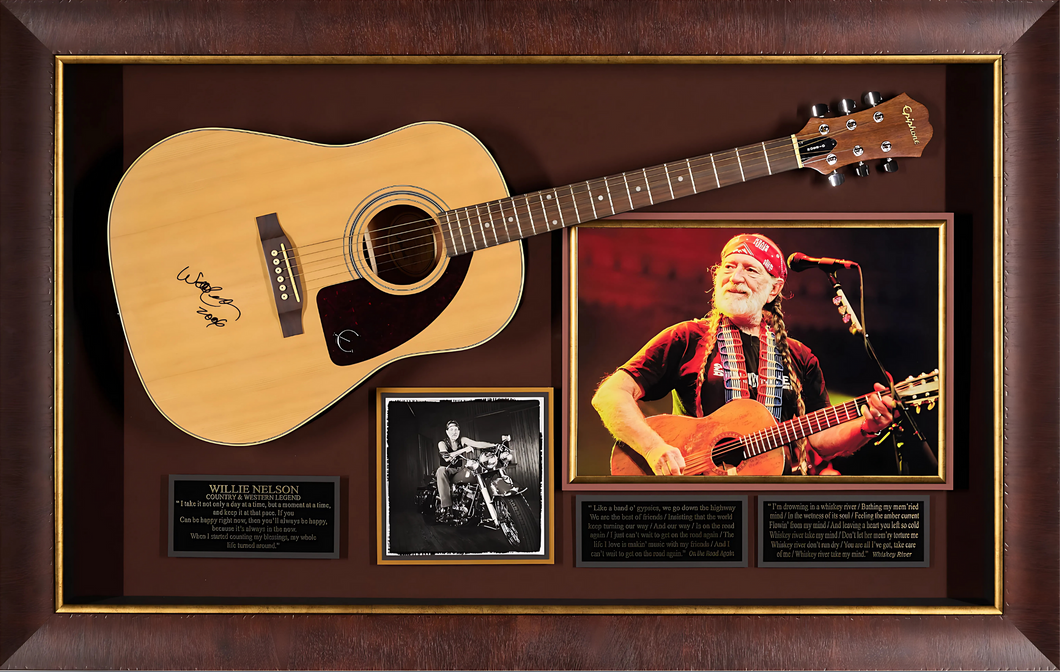Willie Nelson with a JSA Authenticated Signed Guitar