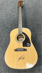 Willie Nelson with a JSA Authenticated Signed Guitar