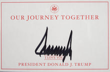 Load image into Gallery viewer, Donald Trump with a cloth America Flag and JSA Authenticated Signature
